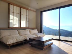 Appartements Logement avec jacuzzi et sauna en terrasse, belle vue panoramique : photos des chambres