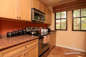 Luxe! Impressively designed 2nd-floor unit in Coco done in red and orange hues