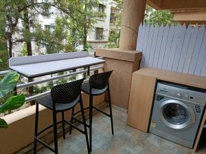 Terra Private Studio with Balcony WiFi Ac Smart TV Kitchenette Washing Machine
