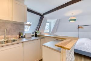 Appartements Elisabeth Confortable studio avec lit double en centre ville : photos des chambres