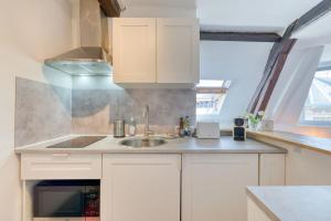 Appartements Elisabeth Confortable studio avec lit double en centre ville : photos des chambres