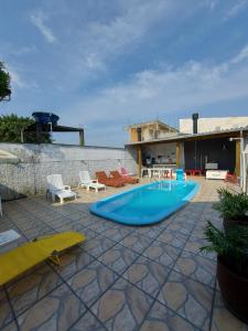 Casa de praia com piscina proximo a praia do Sonho e Pinheira - SC