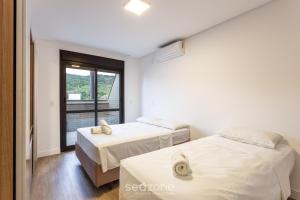 JPR - apartamentos a 260 metros da praia em Jurerê