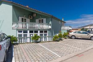Apartments and rooms with a swimming pool Senj - 23592