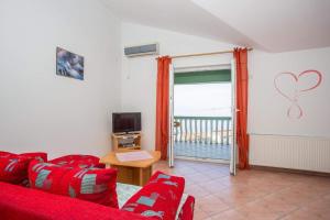 Apartments and rooms with a swimming pool Senj - 23592