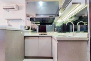 Nice and Homey 1BR at Brooklyn Alam Sutera Apartment By Travelio