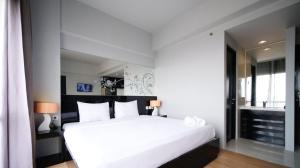 Homey Studio No Kitchen at Grand Darmo Suite Apartment By Travelio