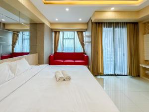 Enchanting and Spacious Studio at La Riz Supermall Mansion Apartment By Travelio