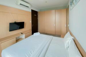 Best Deal and Comfort 1BR at Citralake Suites Apartment By Travelio