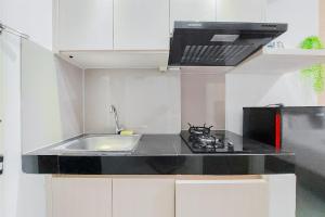 Minimalist and Homey Studio Serpong Garden Apartment By Travelio