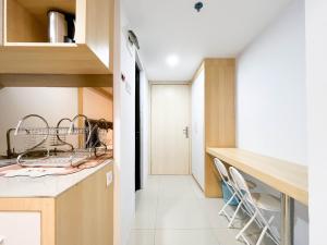 Modern Look Studio at De Prima Apartment By Travelio