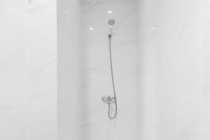 Tranquil and Comfort Living 1BR The Smith Alam Sutera Apartment By Travelio