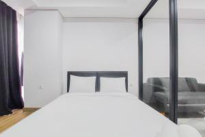 Tranquil and Comfort Living 1BR The Smith Alam Sutera Apartment By Travelio