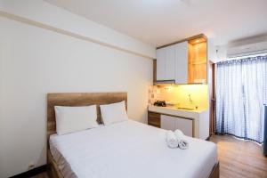Simple and Homey Studio Room at Cinere Resort Apartment By Travelio