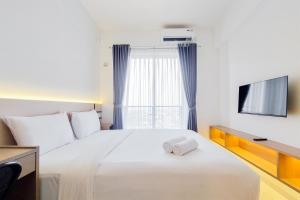 Best and Nice Studio at Sky House BSD Apartment near AEON Mall By Travelio