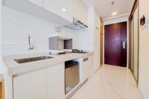 Best and Nice Studio at Sky House BSD Apartment near AEON Mall By Travelio