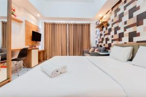 Warm and Homey Studio Room Casa de Parco Apartment By Travelio