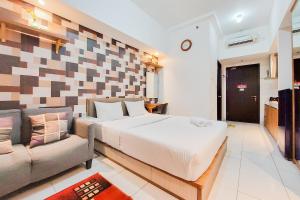 Warm and Homey Studio Room Casa de Parco Apartment By Travelio