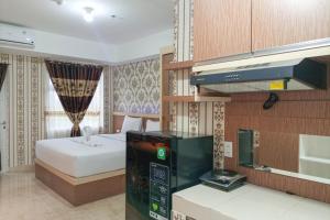 Minimalist and Comfort Studio Podomoro City Deli Medan Apartment By Travelio