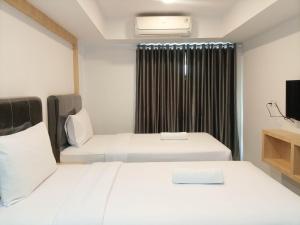 Homey Studio at De Prima Apartment By Travelio