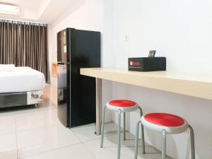 Homey Studio at De Prima Apartment By Travelio