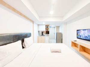 Cozy and Strategic Studio Apartment at De Prima By Travelio