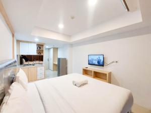 Cozy and Strategic Studio Apartment at De Prima By Travelio