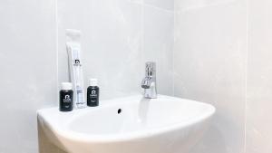 Minimalist and Homey Studio at Evenciio Margonda Apartment By Travelio