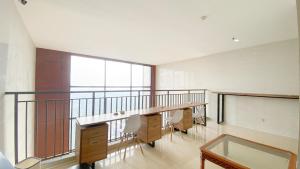 Minimalist and Homey Studio at Evenciio Margonda Apartment By Travelio