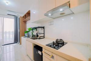 Good and Homey Studio at Sky House BSD Apartment By Travelio