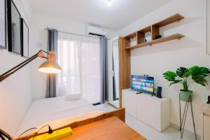 Good and Homey Studio at Sky House BSD Apartment By Travelio
