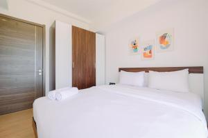 Modern Look 2BR at Sky House BSD Apartment By Travelio