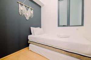 Modern Look 2BR at Sky House BSD Apartment By Travelio