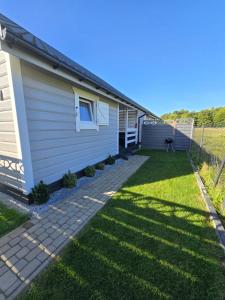 Święty Spokój Rusinowo- domki nad morzem z własnymi ogródkami