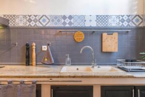 Appartements l-atypique au centre des arcades Elegant Spacieux : photos des chambres