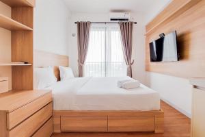 Nice and Comfortable Studio Apartment at Sky House BSD By Travelio