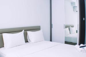 Simply and Well Design Studio Room at Patraland Urbano Apartment By Travelio