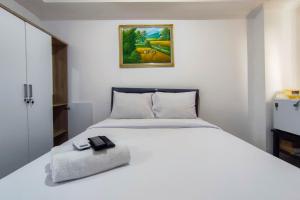 Comfort and Well Design Studio at Paltrow City Apartment By Travelio