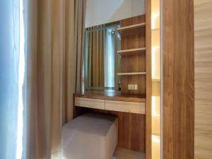 Fancy and Nice 1BR with Extra Room at Amartha View Apartment By Travelio