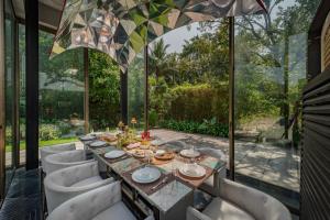 SaffronStays Glasshouse 91 - 4BR luxury villa with pool, art installations, lawns & outdoor dining