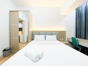 Comfort and Cozy Stay 1BR at The Alton Apartment By Travelio