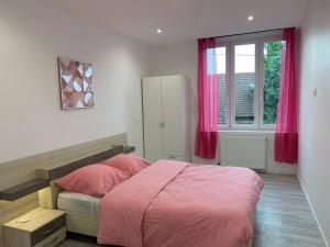 Appartements Grande maison tout confort : photos des chambres