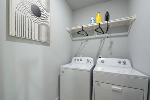 Modern 2024 Townhome with Indoor Hoops Huge TVs and Gray Chic Design