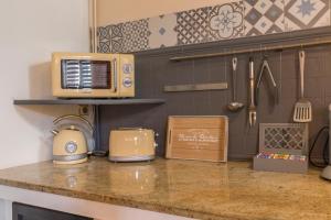 Appartements l-atypique au centre des arcades Elegant Spacieux : photos des chambres