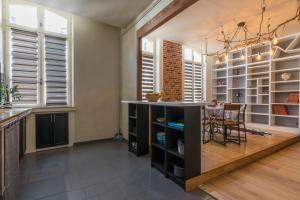 Appartements l-atypique au centre des arcades Elegant Spacieux : photos des chambres