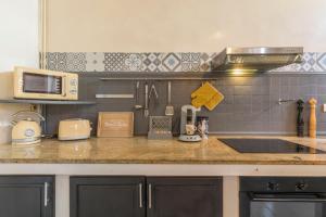 Appartements l-atypique au centre des arcades Elegant Spacieux : photos des chambres