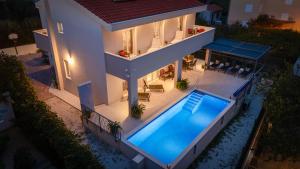 Villa Leonore in Omis with 4 en-suite bedrooms, heated pool, PS5, completely fenced yard & just 3 mi