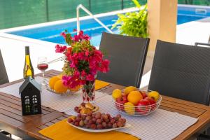 Villa Leonore in Omis with 4 en-suite bedrooms, heated pool, PS5, completely fenced yard & just 3 mi 