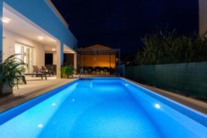Villa Leonore in Omis with 4 en-suite bedrooms, heated pool, PS5, completely fenced yard & just 3 mi 