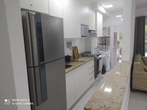 Praia das Toninhas Ubatuba Ap novo e mobiliado Condomínio com Piscina